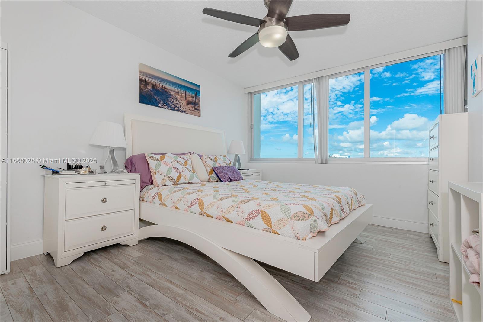 7135 Collins Avenue, Unit 625 Miami Beach, FL 33141 - Photo 24 of 33 a bedroom with a large bed and a window