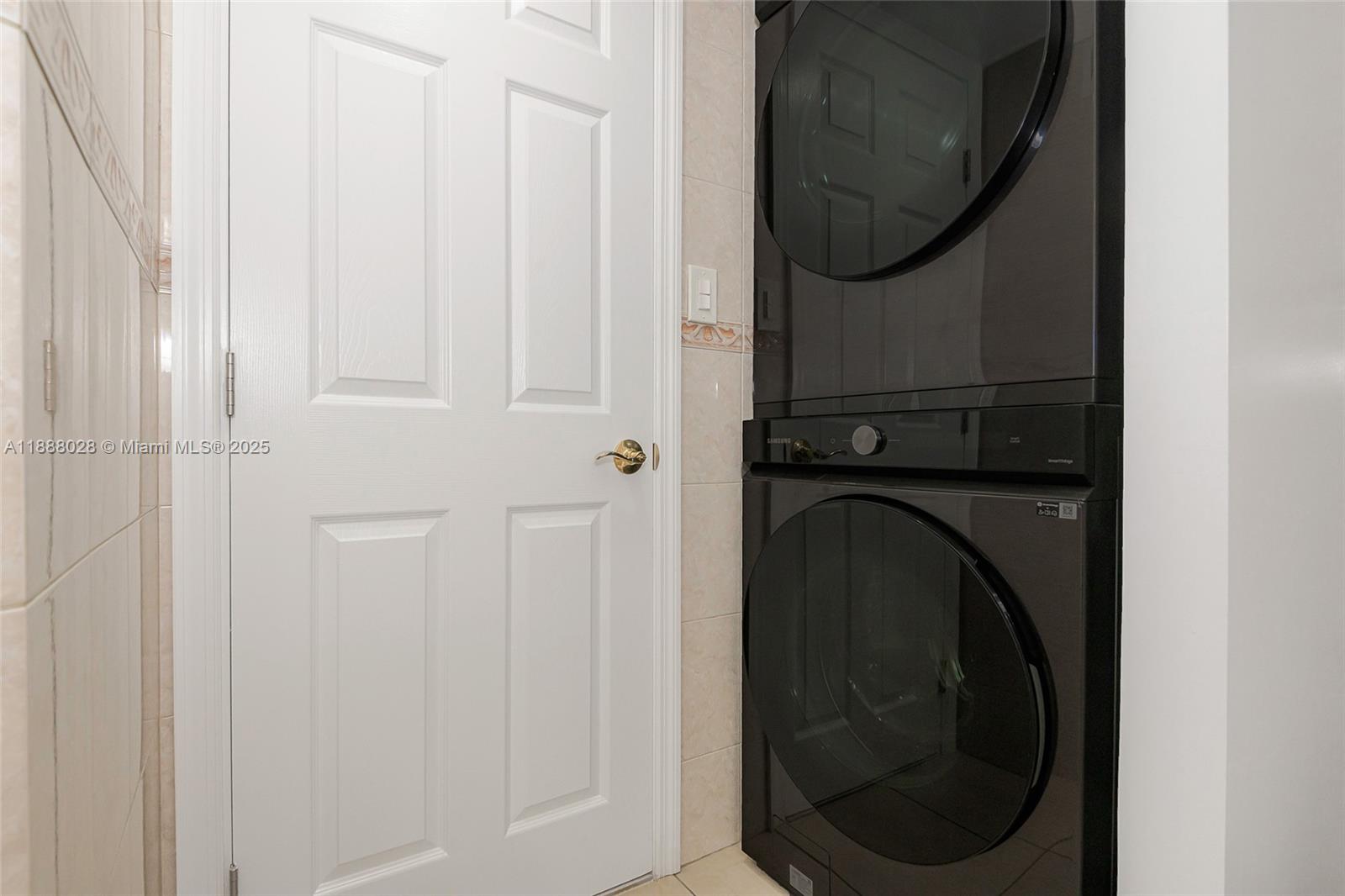 7135 Collins Avenue, Unit 625 Miami Beach, FL 33141 - Photo 28 of 33 a close up view of a washer and dryer
