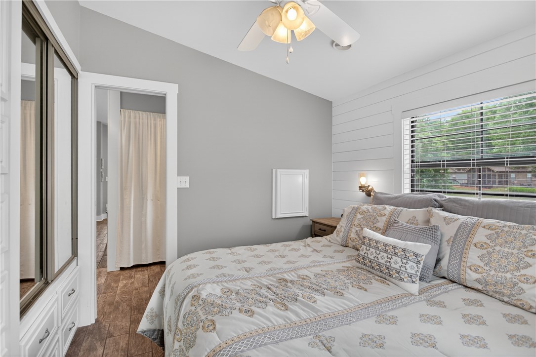 1230 Melton Road, Unit 4 West Union, SC 29696 - Photo 25 of 48 A well-lit bedroom with wood flooring and a refreshing ceiling fan offers a comfortable retreat.