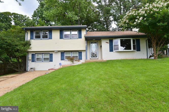 5918 Atteentee Road Springfield, VA 22150 - Photo 2 of 25 a front view of a house with a garden and yard