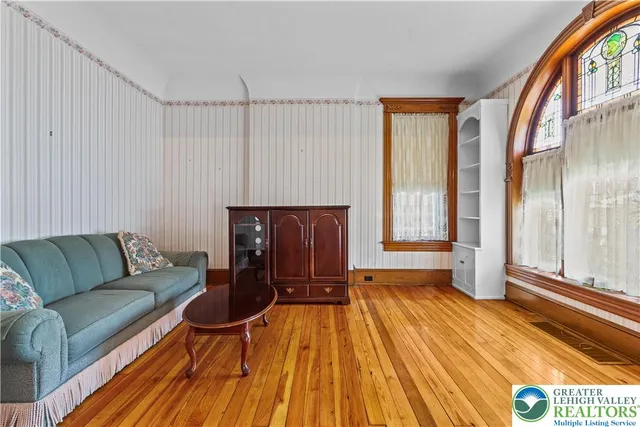 a view of a room with a furniture and a carpet