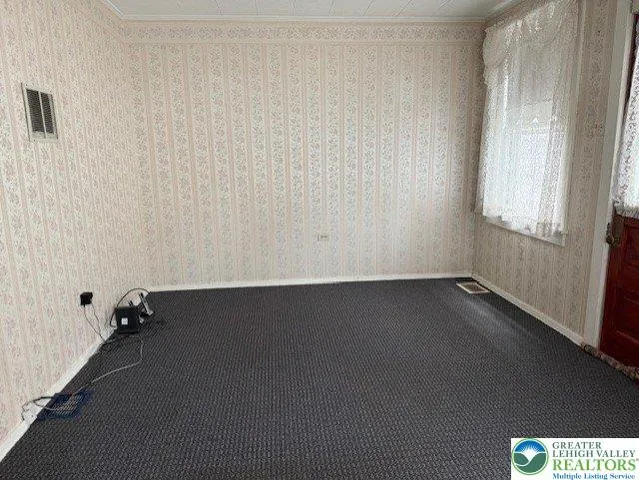 a kitchen with stainless steel appliances granite countertop a stove top oven a refrigerator a sink and dishwasher with a dining table