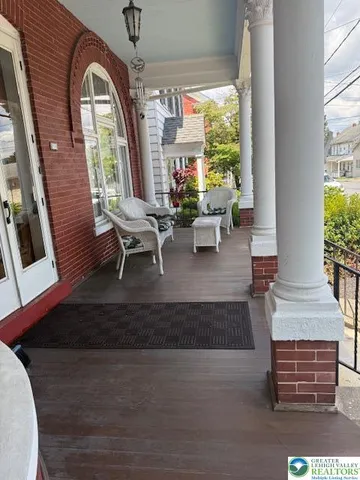 a view of a patio with table and chairs