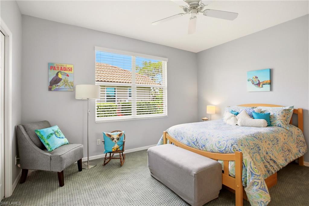 10815 Phoenix Way Naples, FL 34119 - Photo 24 of 40 a bedroom with a bed and a couch
