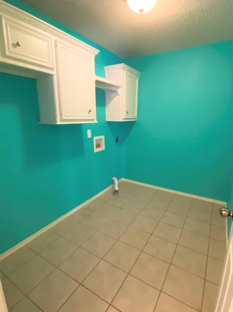 a view of a kitchen cabinetry and a window