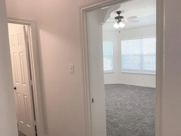 a view of an empty room with a window