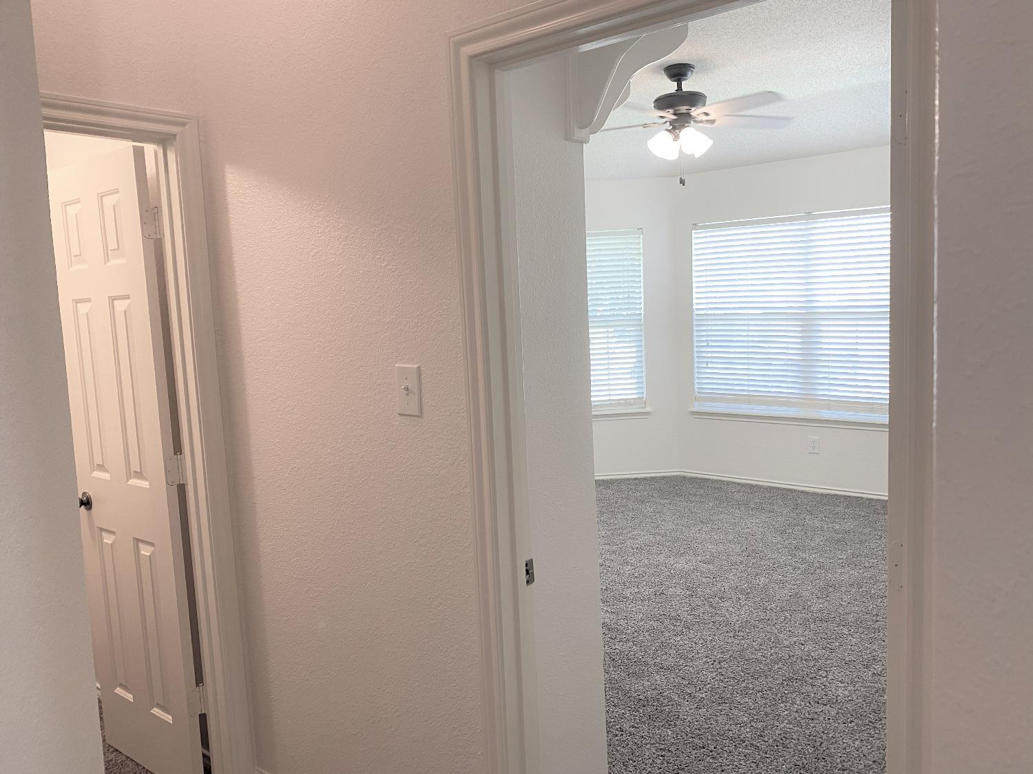 6521 8th Street Lubbock, TX 79416 - Photo 3 of 25 a view of an empty room with a window