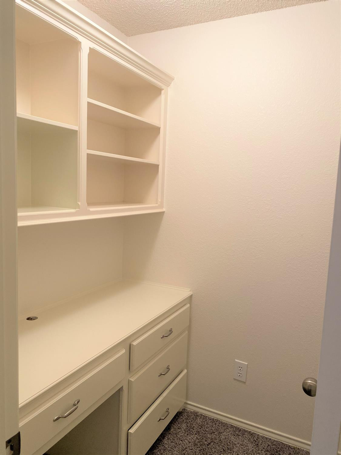 6521 8th Street Lubbock, TX 79416 - Photo 6 of 25 a view of storage area with empty racks