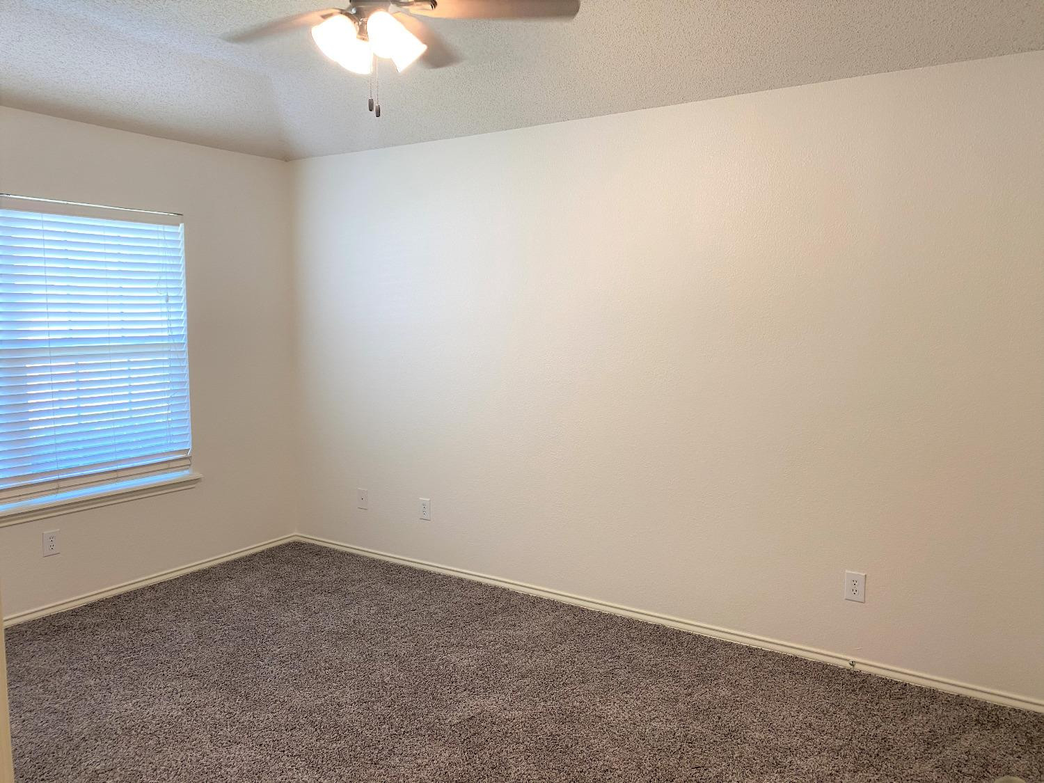 6521 8th Street Lubbock, TX 79416 - Photo 9 of 25 an empty room with a window