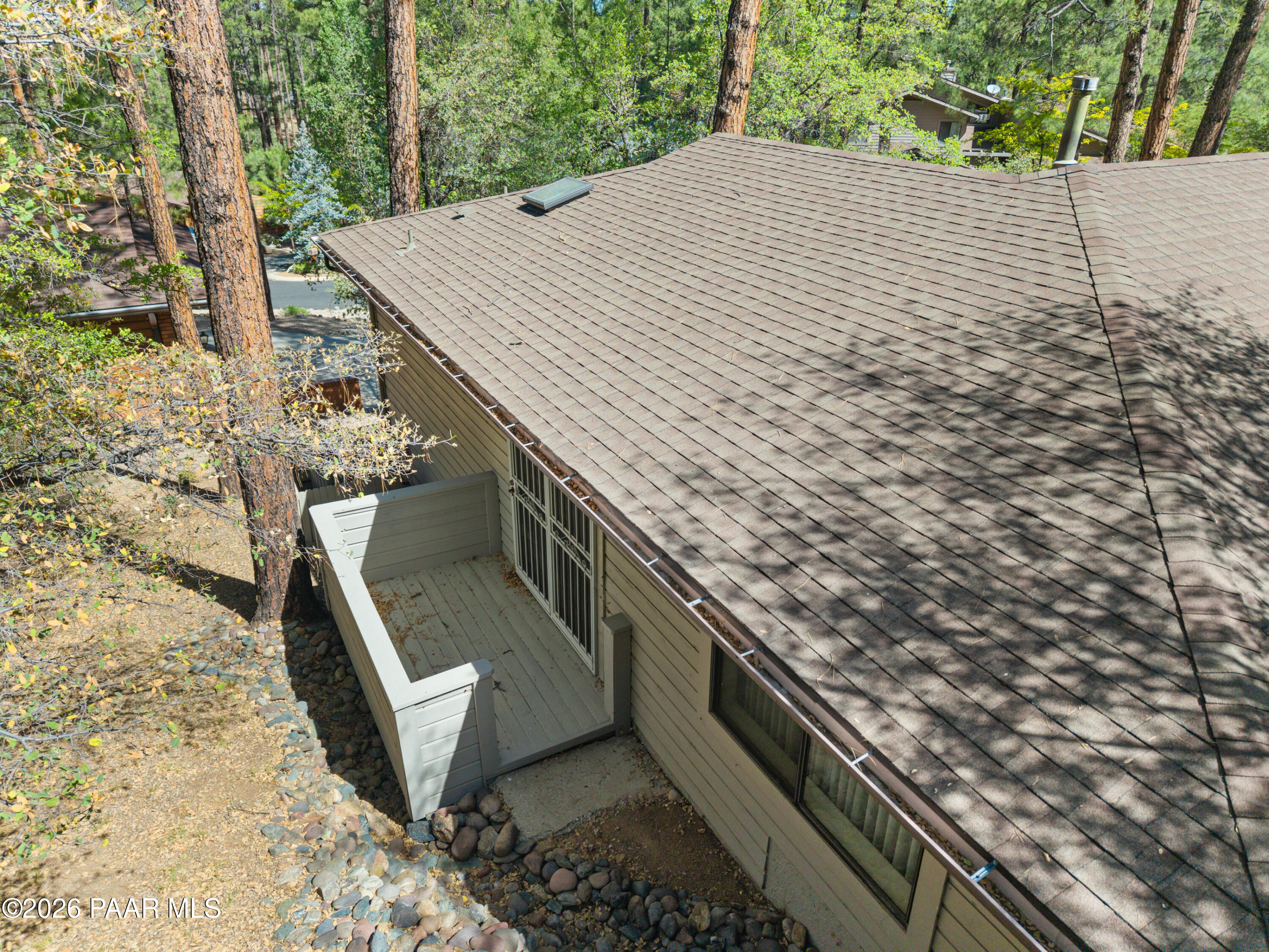 305 Ridge Court Prescott, AZ 86303 - Photo 21 of 35 a view of a backyard with plants and wooden fence