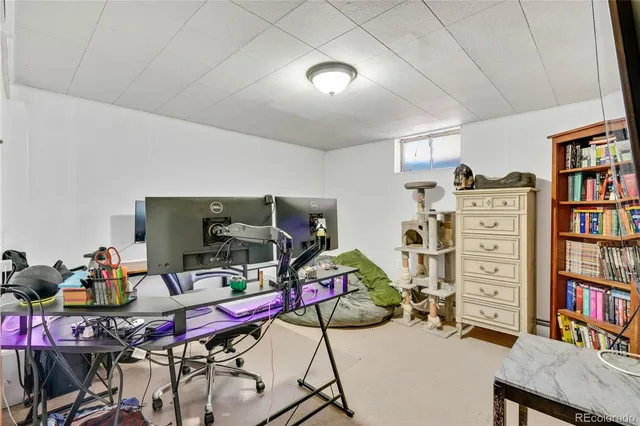 a workspace with furniture and book shelf