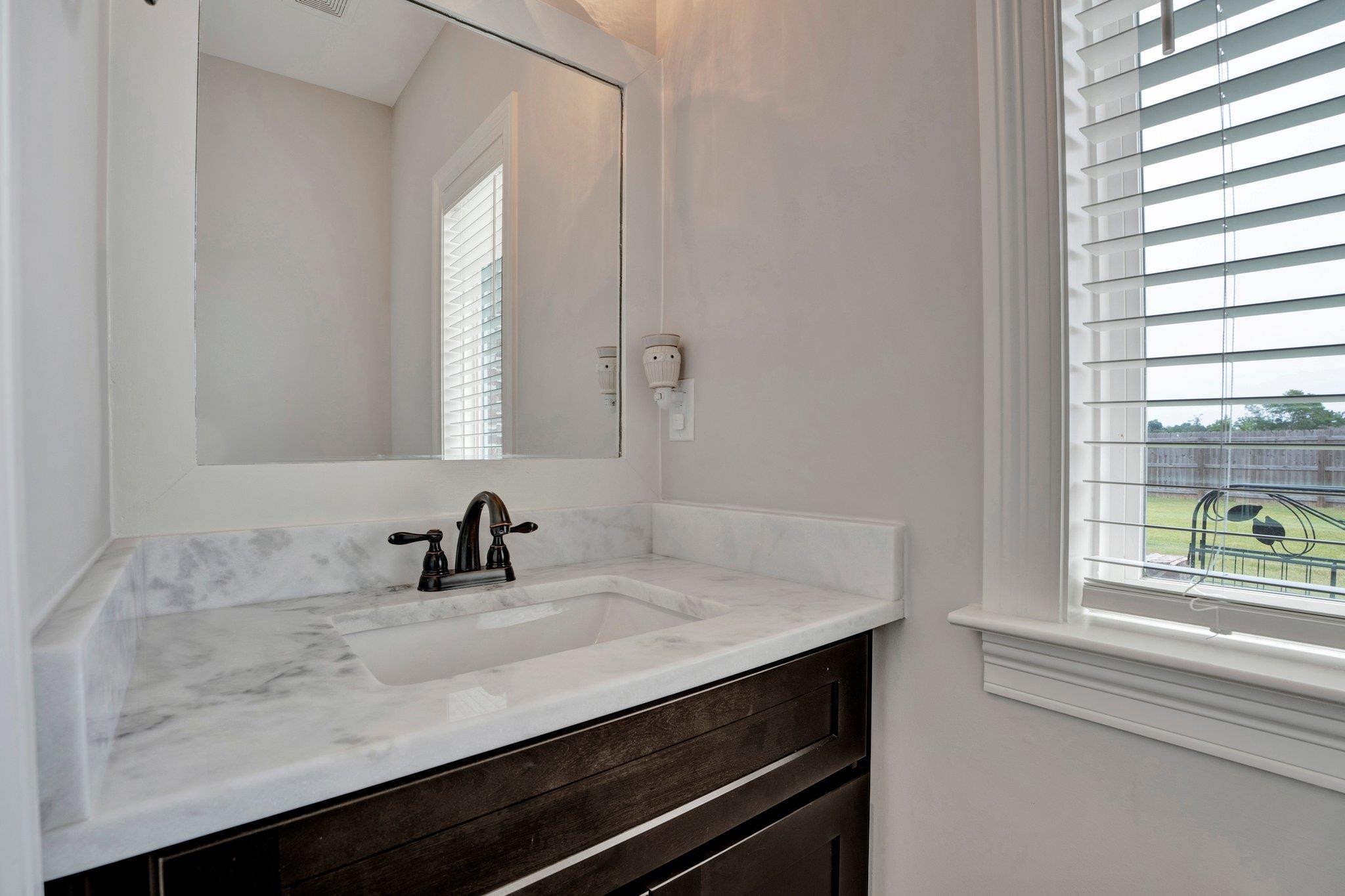 21 Trinity Cove Atoka, TN 38004 - Photo 11 of 21 a bathroom with a sink and a window