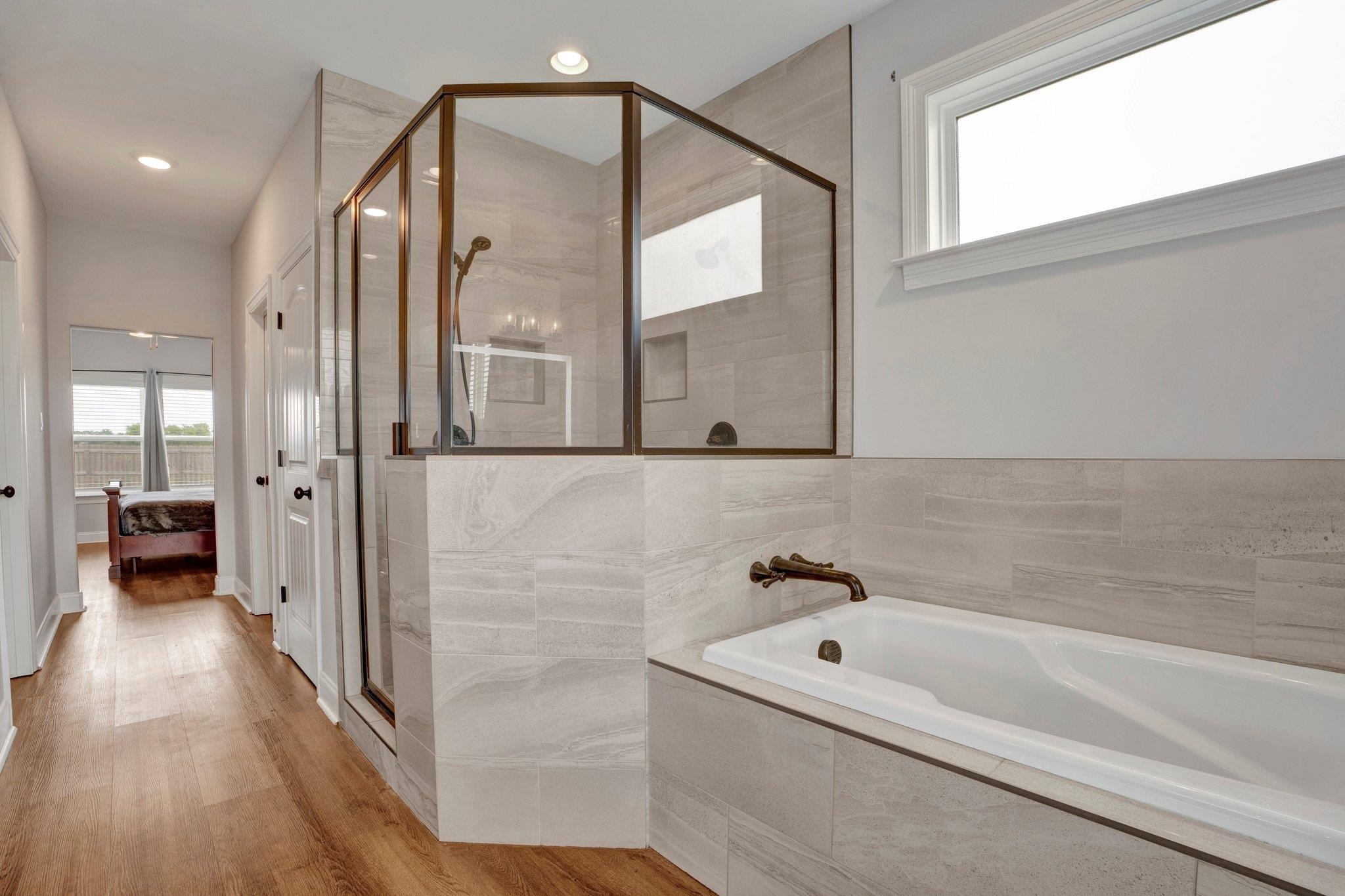 21 Trinity Cove Atoka, TN 38004 - Photo 14 of 21 a bathroom with a bathtub and a mirror