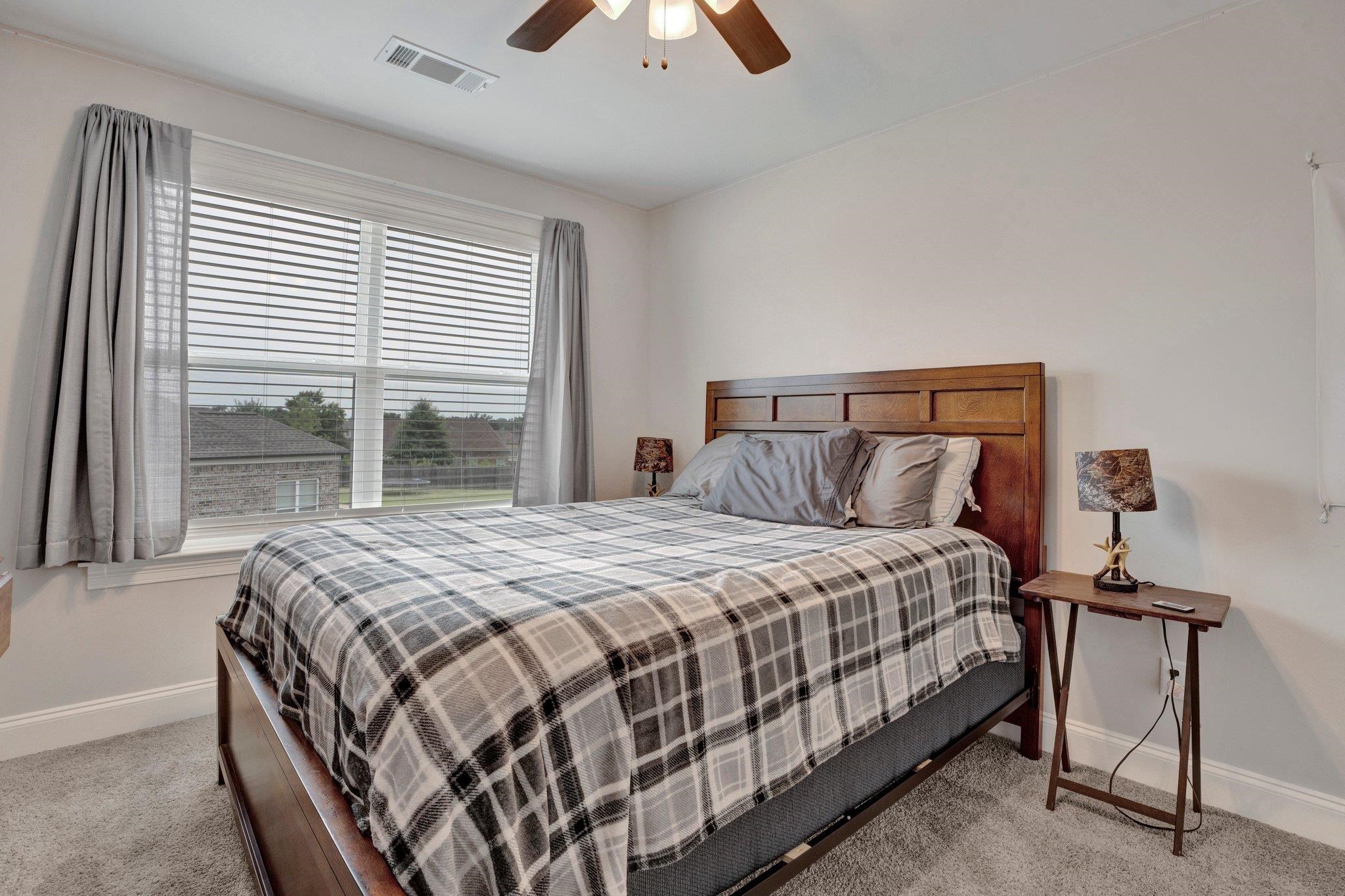 21 Trinity Cove Atoka, TN 38004 - Photo 16 of 21 a bedroom with a bed and a window