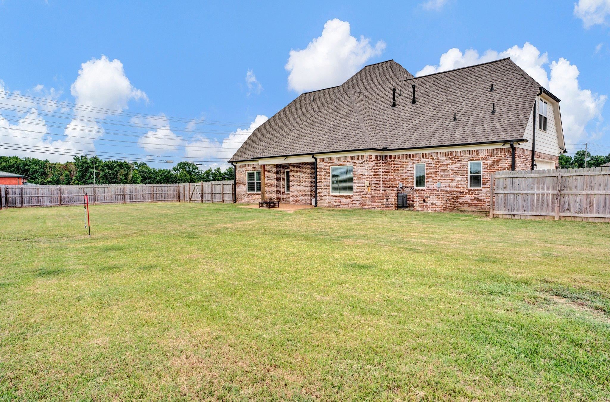 21 Trinity Cove Atoka, TN 38004 - Photo 19 of 21 a view of a house with a yard and sitting area