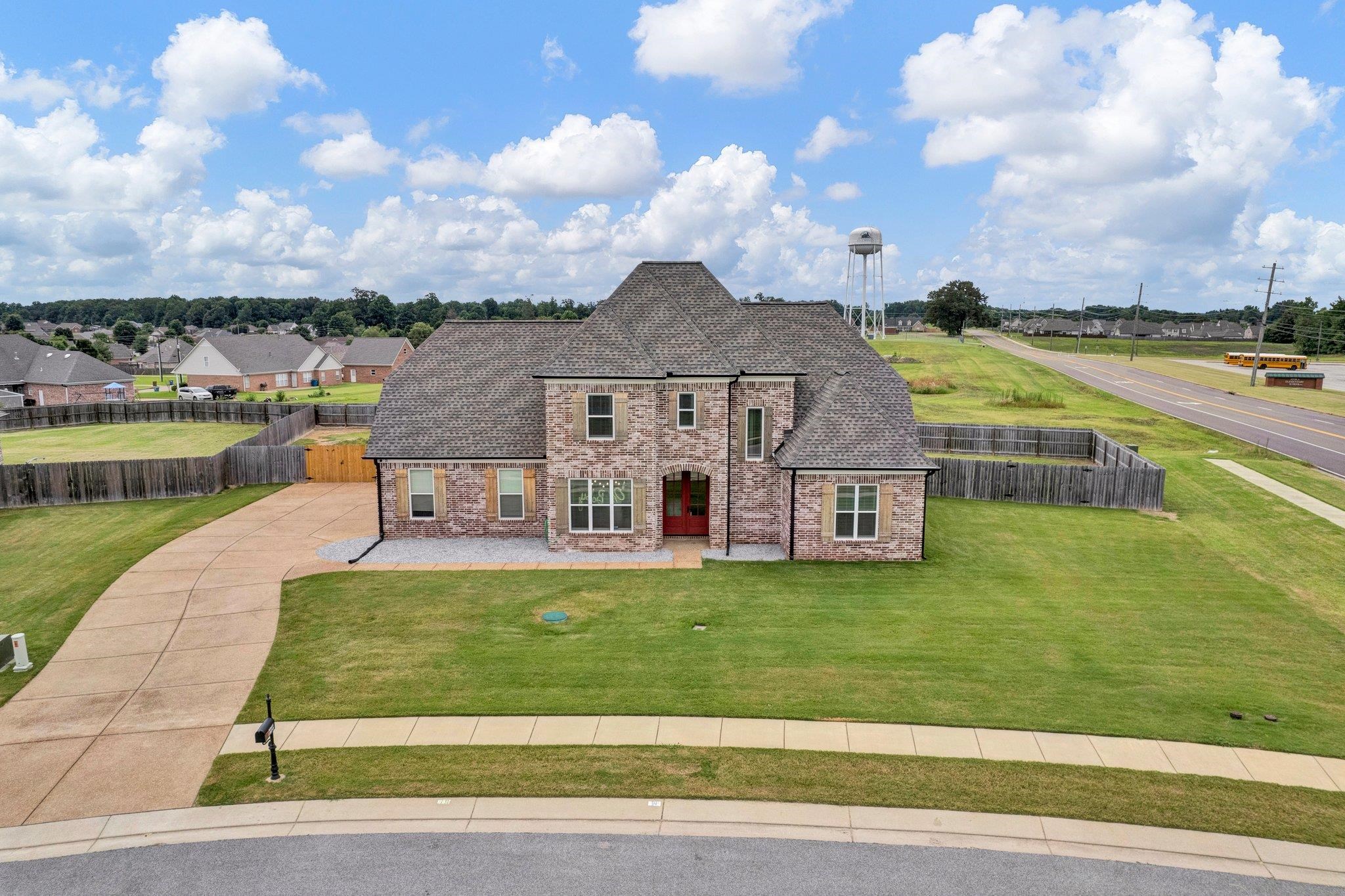 21 Trinity Cove Atoka, TN 38004 - Photo 20 of 21 a view of a house with a big yard and a large tree