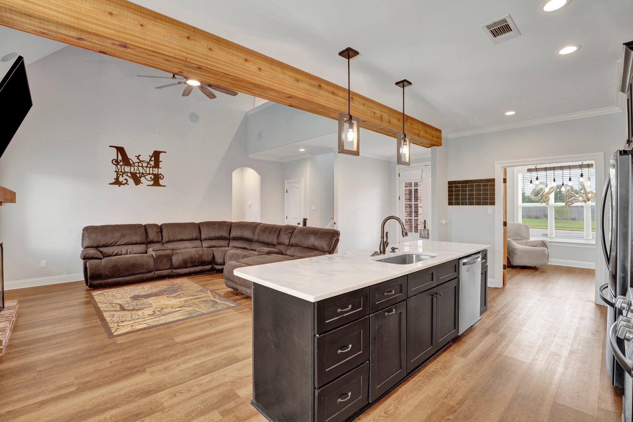 21 Trinity Cove Atoka, TN 38004 - Photo 7 of 21 a kitchen with a sink and a stove top oven