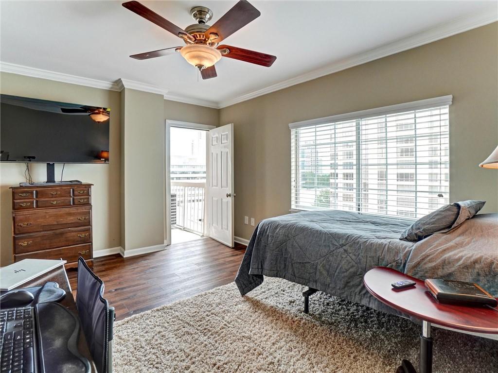3435 Kingsboro Road Northeast, Unit 1601 Atlanta, GA 30326 - Photo 26 of 54 a bedroom with a bed and a chandelier