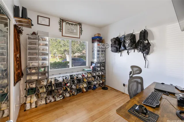 a bed room with two beds and a window