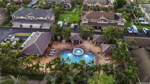 an aerial view of a house with garden space and lake view
