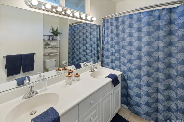 a bathroom with a sink a vanity and a mirror