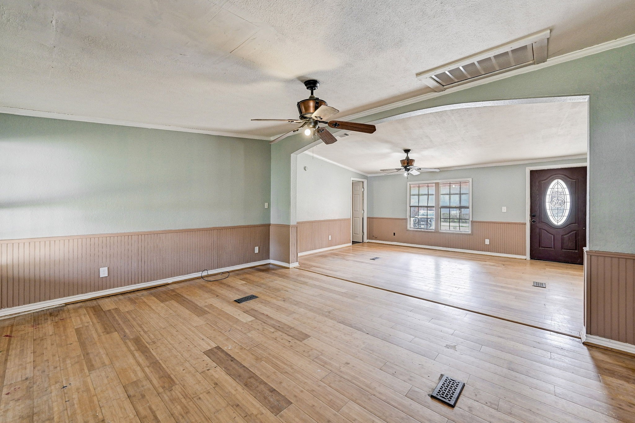 858 Big Hawg Road Trinity, TX 75862 - Photo 12 of 47 a view of an empty room with a window and wooden floor