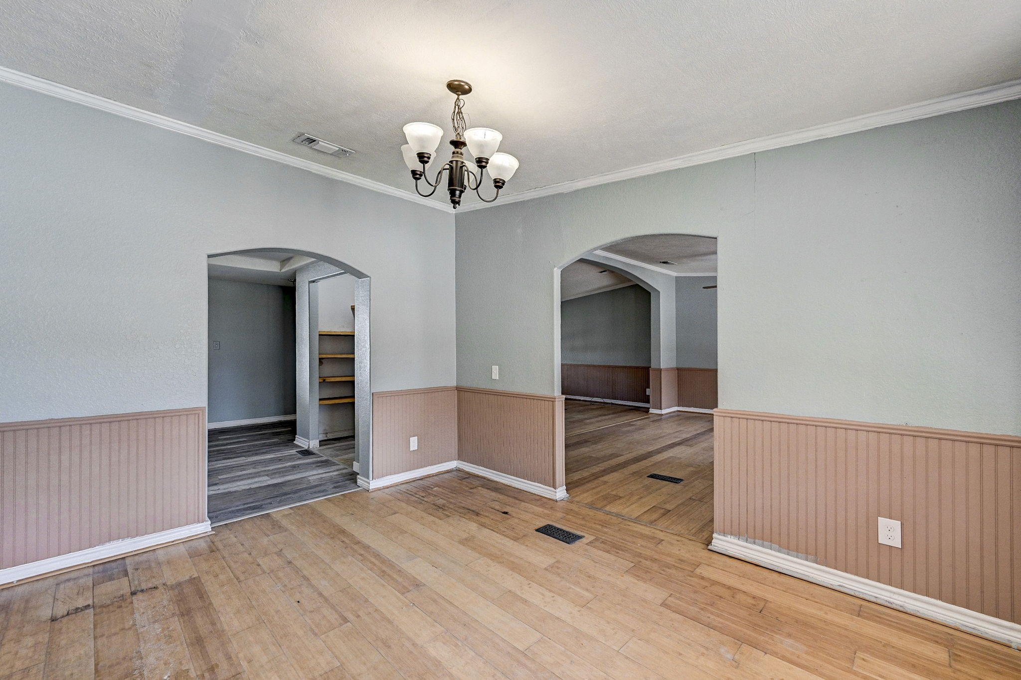 858 Big Hawg Road Trinity, TX 75862 - Photo 19 of 47 wooden floor in an empty room with a chandelier