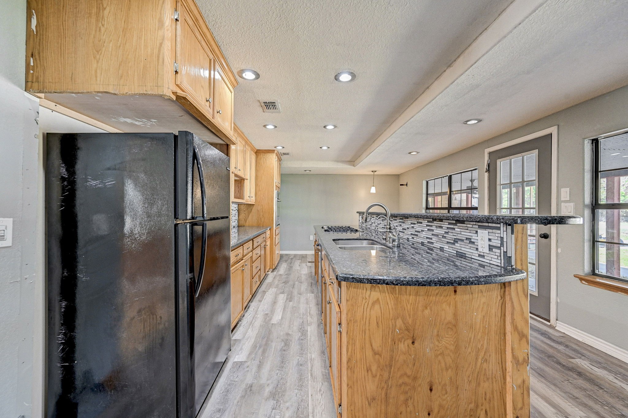 858 Big Hawg Road Trinity, TX 75862 - Photo 20 of 47 a kitchen with stainless steel appliances granite countertop a refrigerator and a counter space