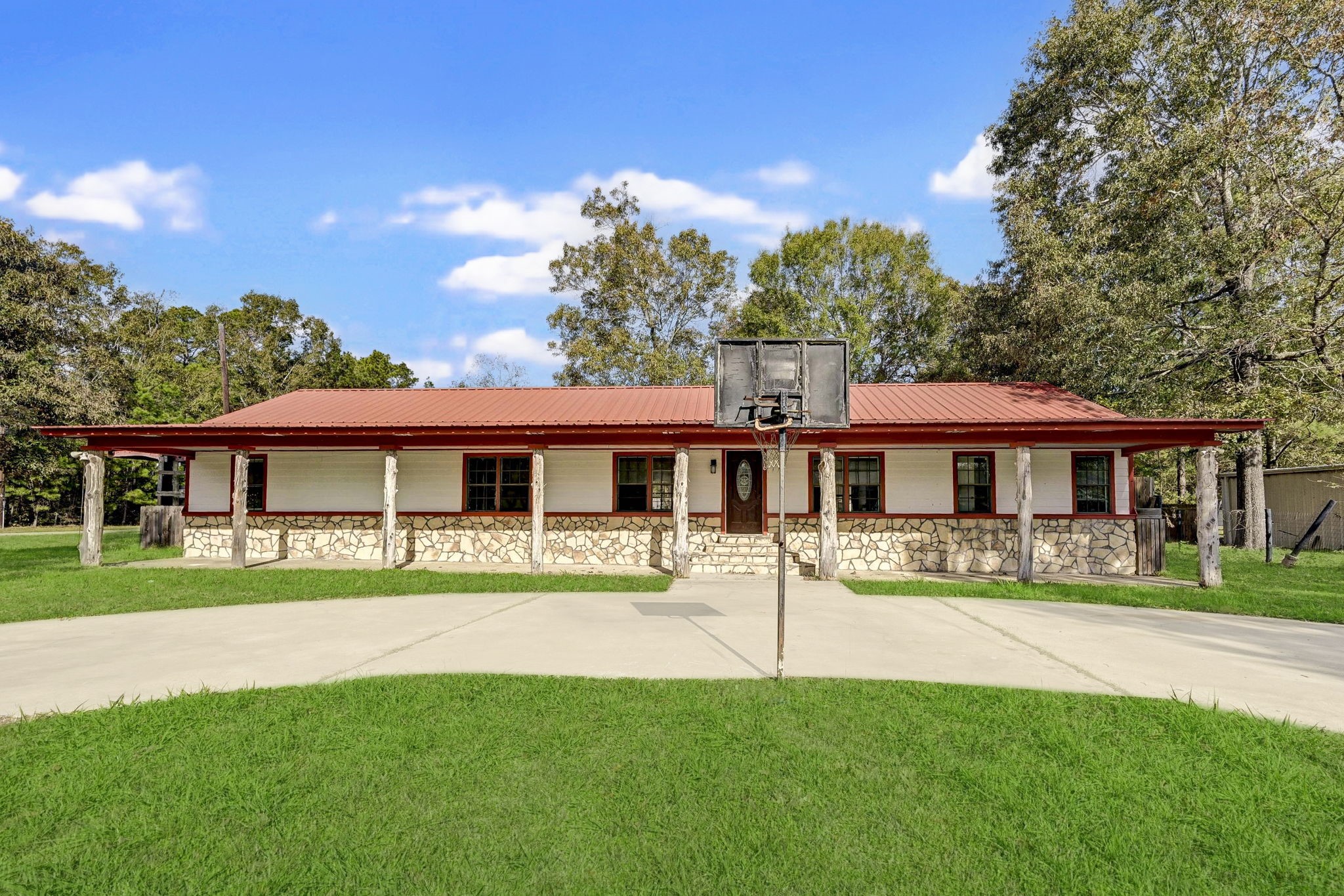 858 Big Hawg Road Trinity, TX 75862 - Photo 2 of 47 a view of a house with a yard porch and sitting area