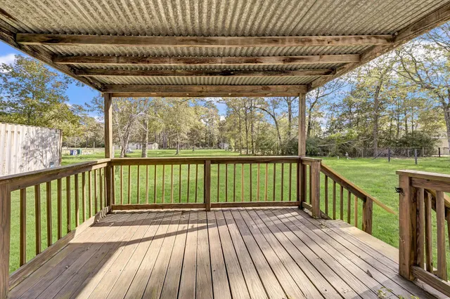 a view of balcony with wooden floor