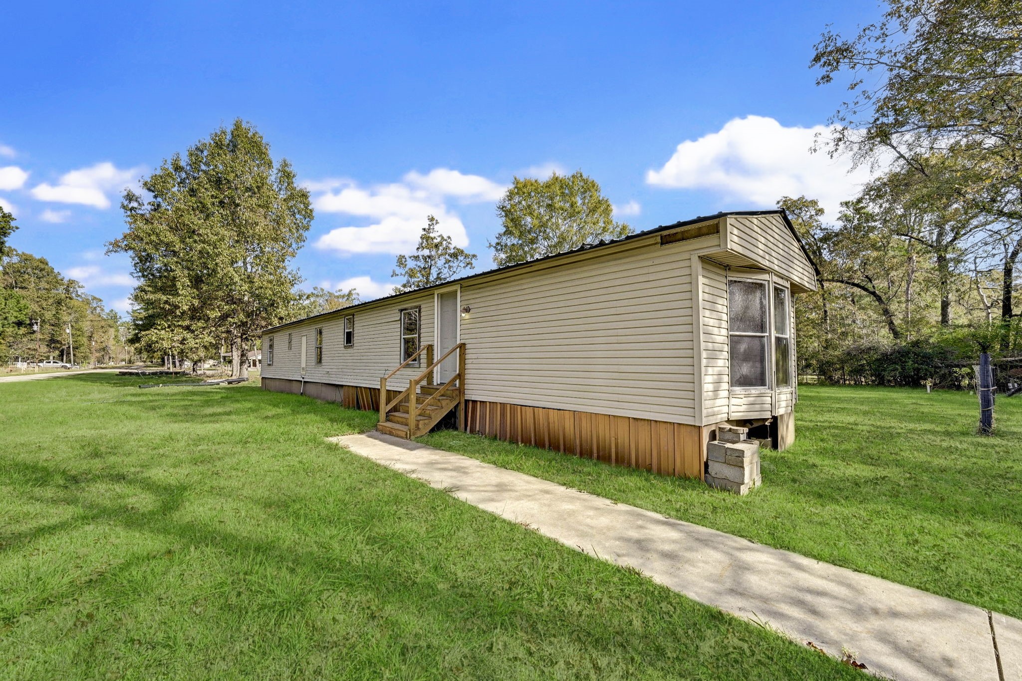 858 Big Hawg Road Trinity, TX 75862 - Photo 40 of 47 a backyard of a house with table and chairs