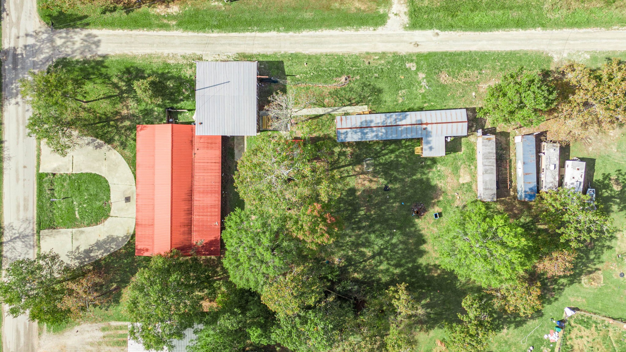 858 Big Hawg Road Trinity, TX 75862 - Photo 42 of 47 an aerial view of a house with a yard and potted plants