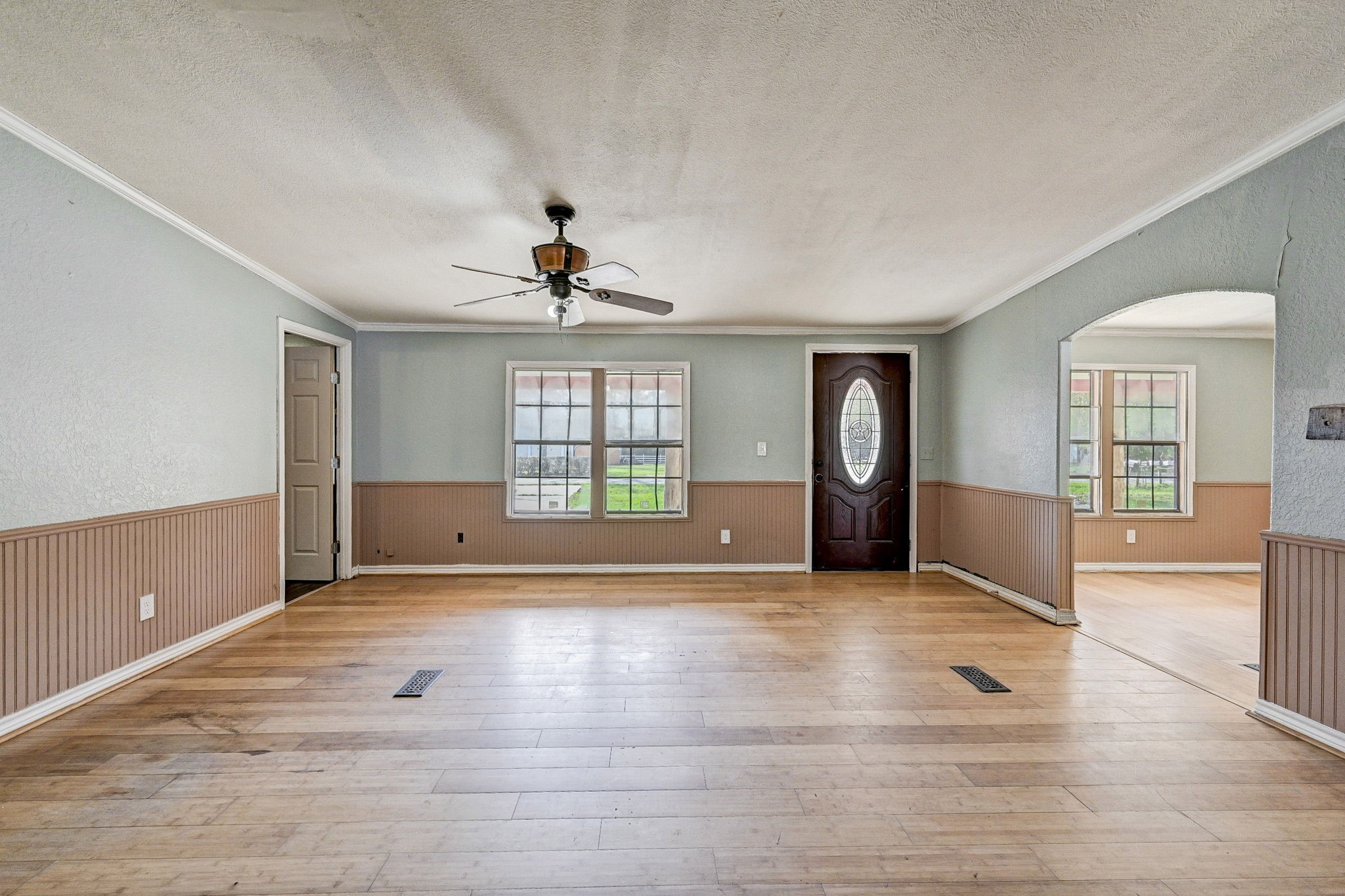 858 Big Hawg Road Trinity, TX 75862 - Photo 10 of 47 a view of an empty room with a window and wooden floor