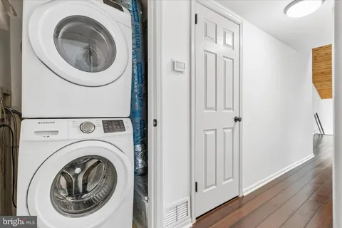 a view of a hallway with washer and dryer