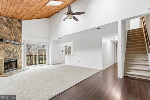 wooden floor in an empty room with a fireplace