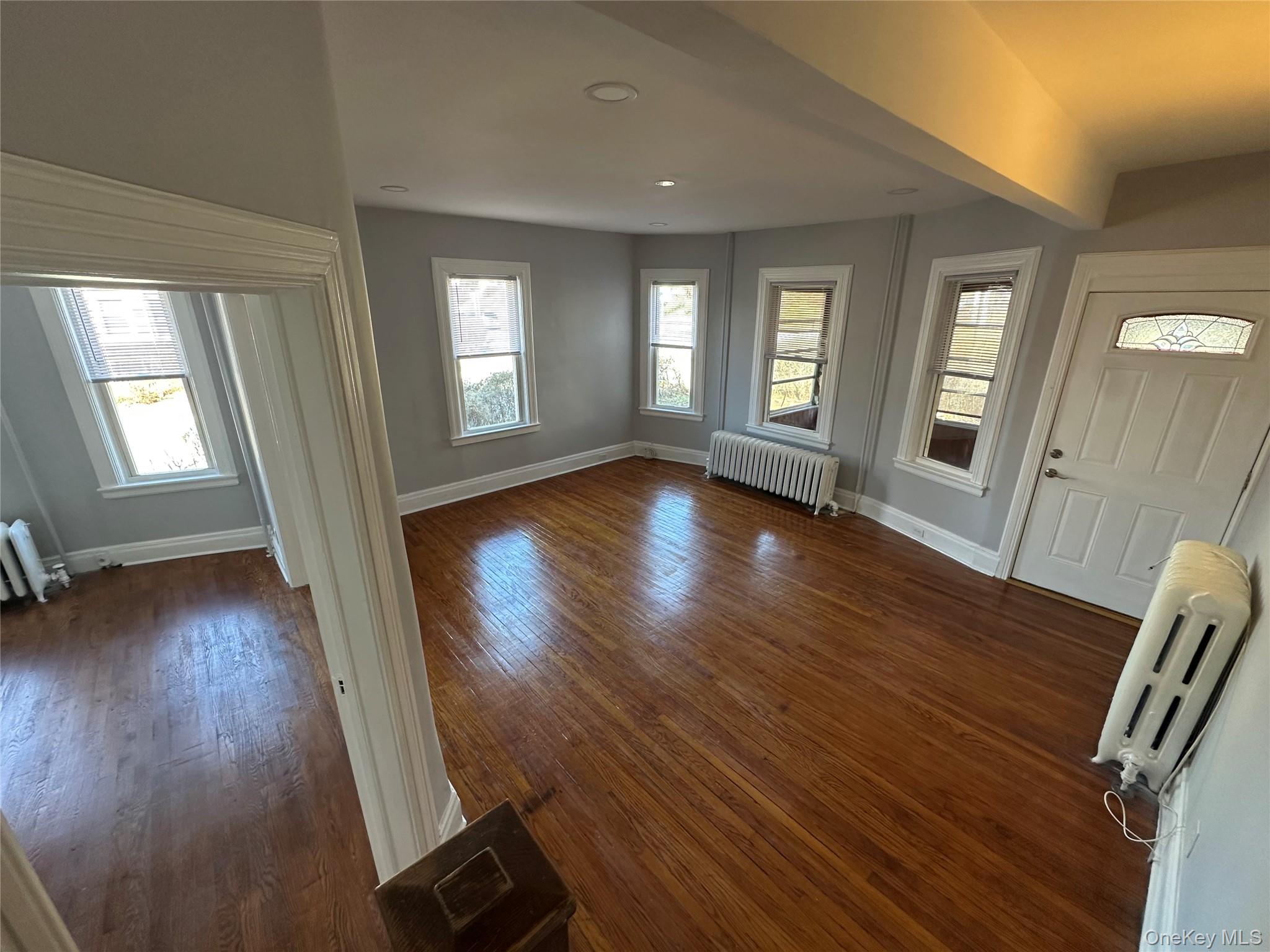 400 Dyckman Street Peekskill, NY 10566 - Photo 1 of 1 a view of an empty room with wooden floor and a window