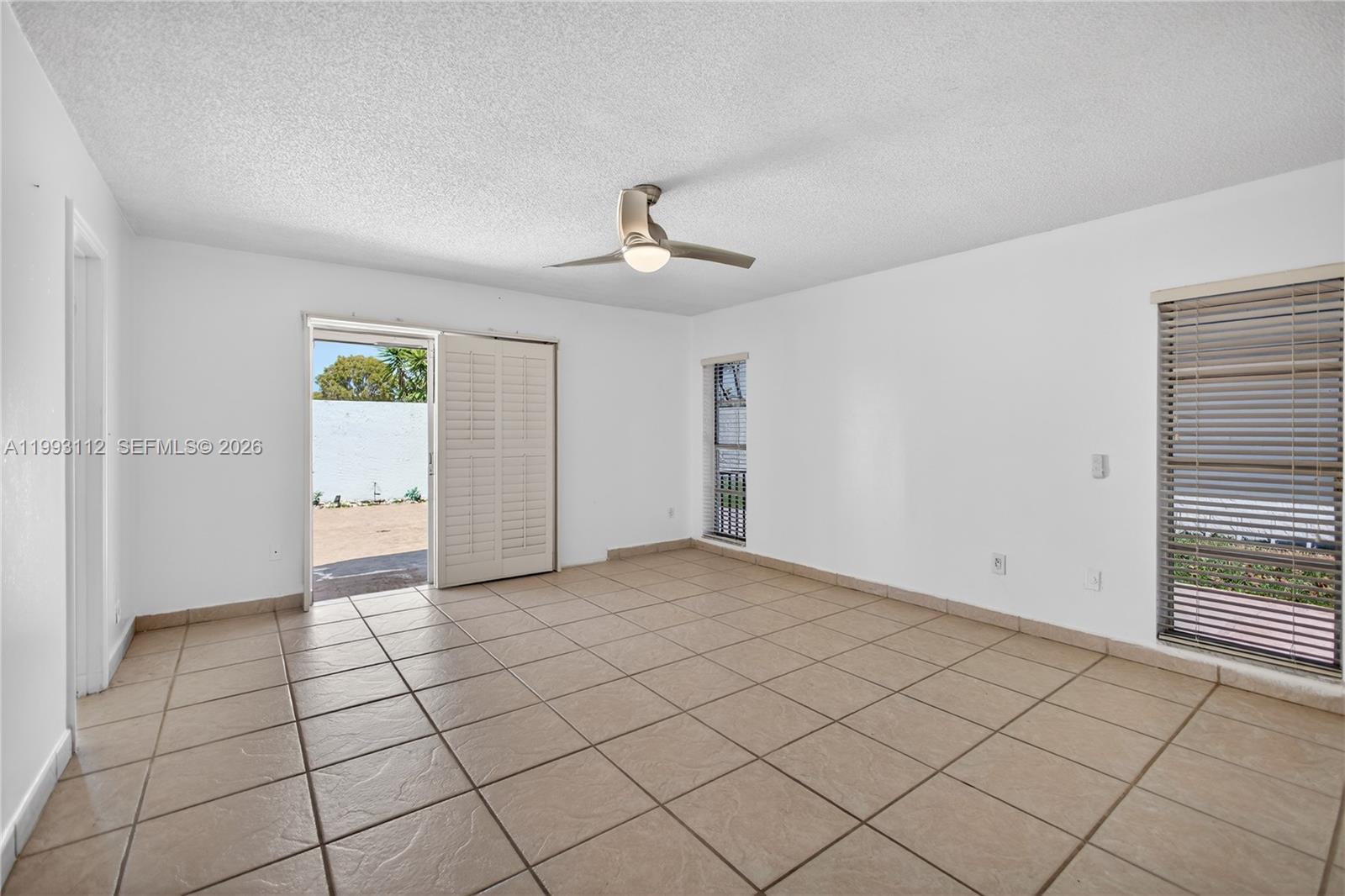 13471 Southwest 99th Terrace Miami, FL 33186 - Photo 20 of 44 a view of an empty room and window