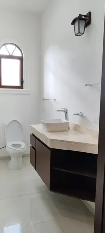 a view of staircase with white walls and a window