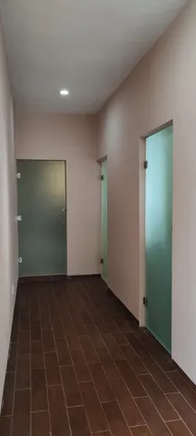 a kitchen with kitchen island a stove and a wooden floor