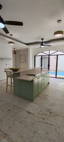 a view of a dining room with furniture and a chandelier
