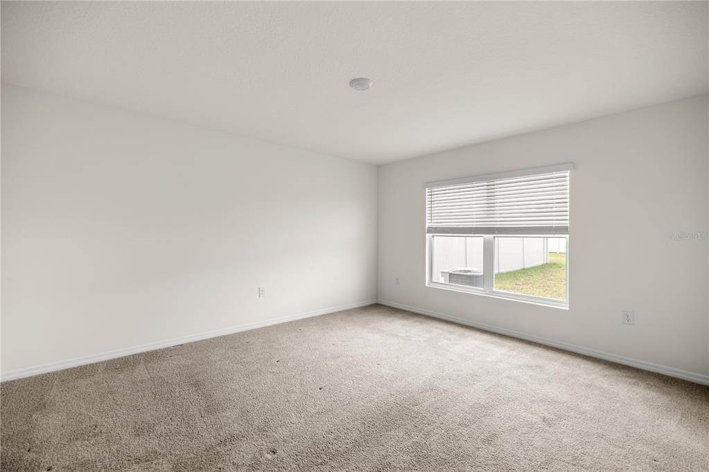 6563 Southeast 1st Loop Ocala, FL 34472 - Photo 15 of 24 an empty room with a window