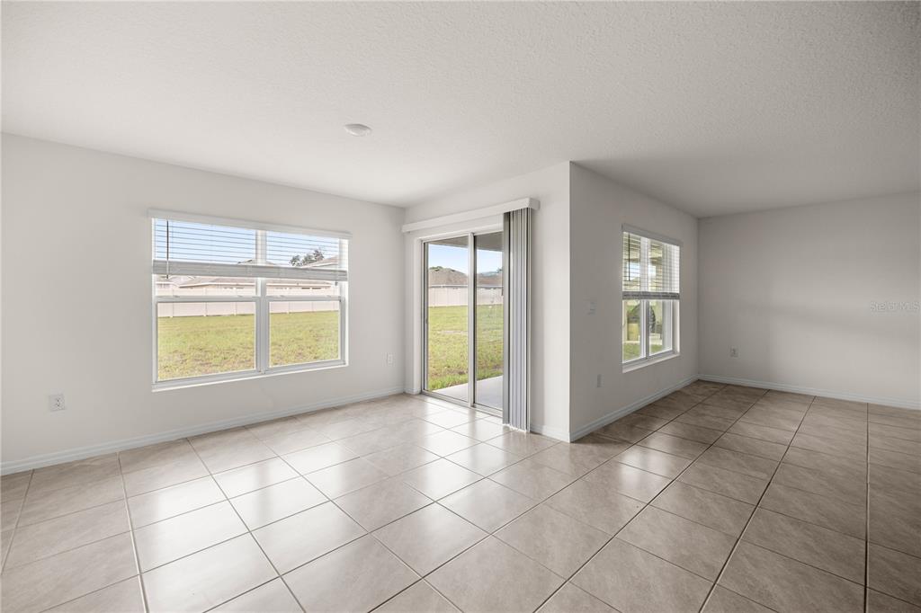 6563 Southeast 1st Loop Ocala, FL 34472 - Photo 16 of 24 a view of an empty room with a window