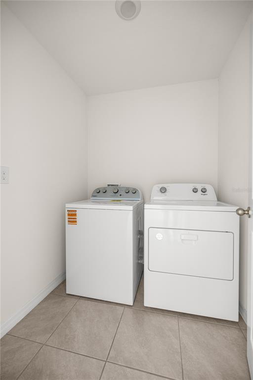 6563 Southeast 1st Loop Ocala, FL 34472 - Photo 18 of 24 a utility room with dryer and washer