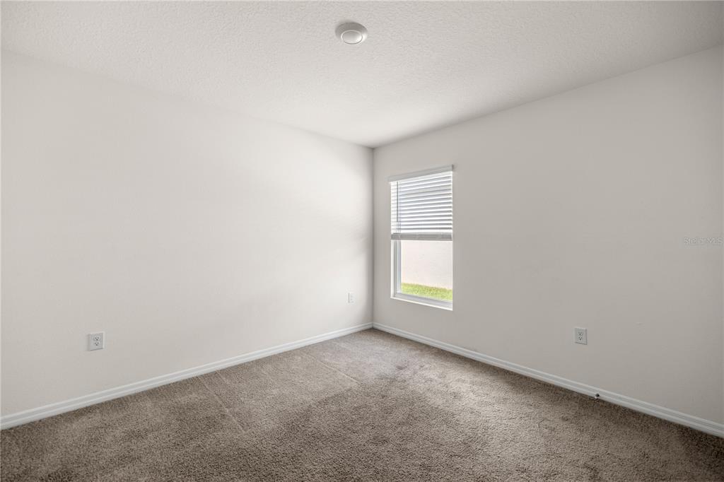 6563 Southeast 1st Loop Ocala, FL 34472 - Photo 20 of 24 an empty room with a window