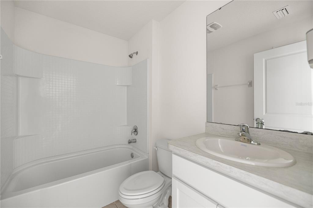 6563 Southeast 1st Loop Ocala, FL 34472 - Photo 21 of 24 a bathroom with a sink toilet and shower