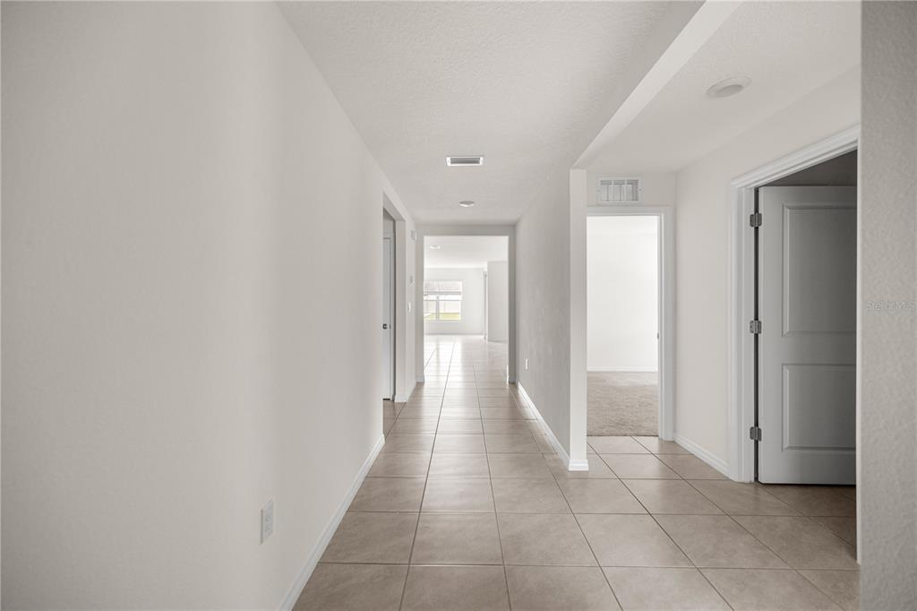 6563 Southeast 1st Loop Ocala, FL 34472 - Photo 24 of 24 a view of a hallway with wooden shelves