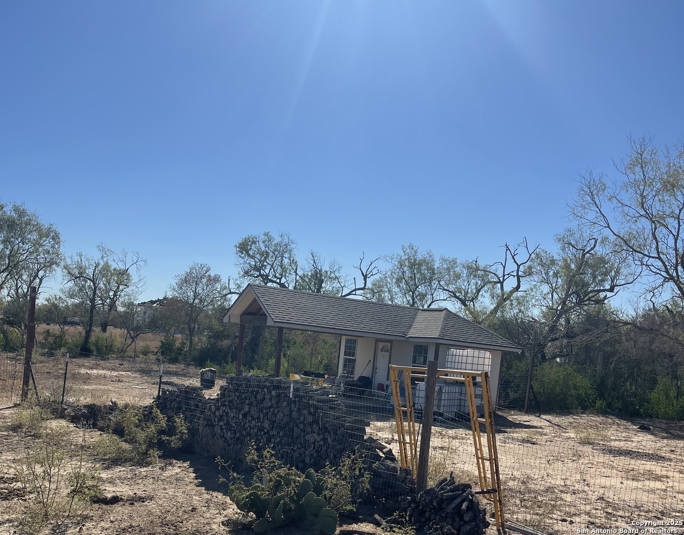 0 Fm 1346 St. Hedwig, TX 78152 - Photo 6 of 17 a front view of a house with a garden