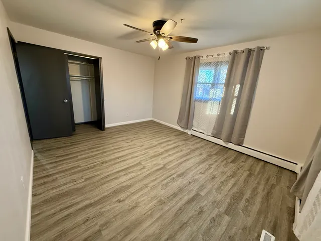 a view of an empty room with a window