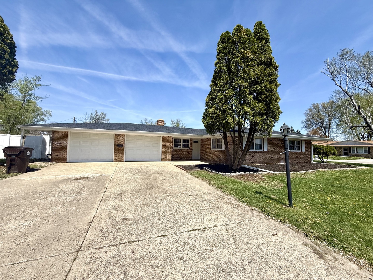 1357 Jeffrey Drive Rantoul, IL 61866 - Photo 2 of 21 a front view of a house with a yard