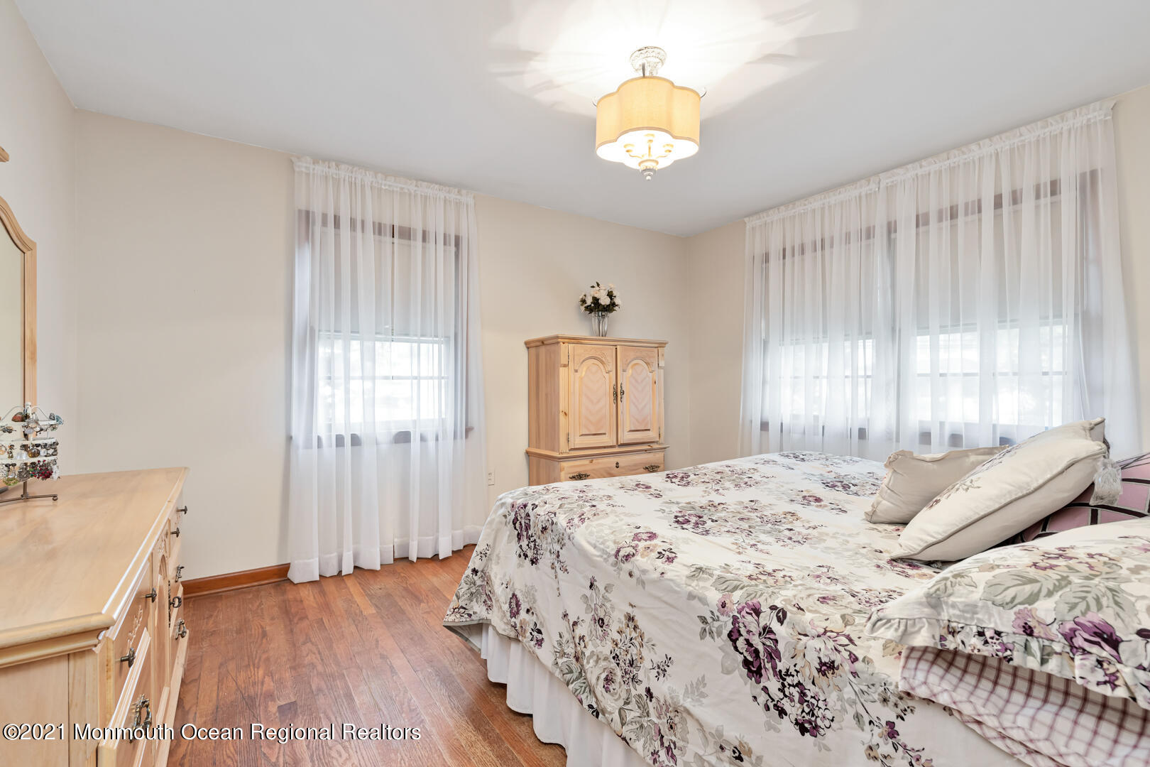 110 Bethany Road Hazlet, NJ 07730 - Photo 13 of 22 a bedroom with a bed and wooden floor